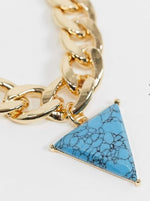 Load image into Gallery viewer, necklace with curb chain and faux turquoise triangle pendant in gold tone
